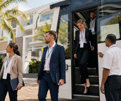 Conference delegates arriving by coach at a business hotel