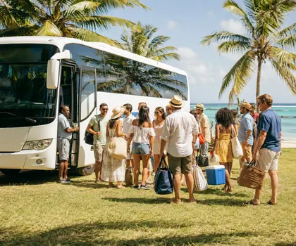 A large group boarding a coach beside the beach for a day out